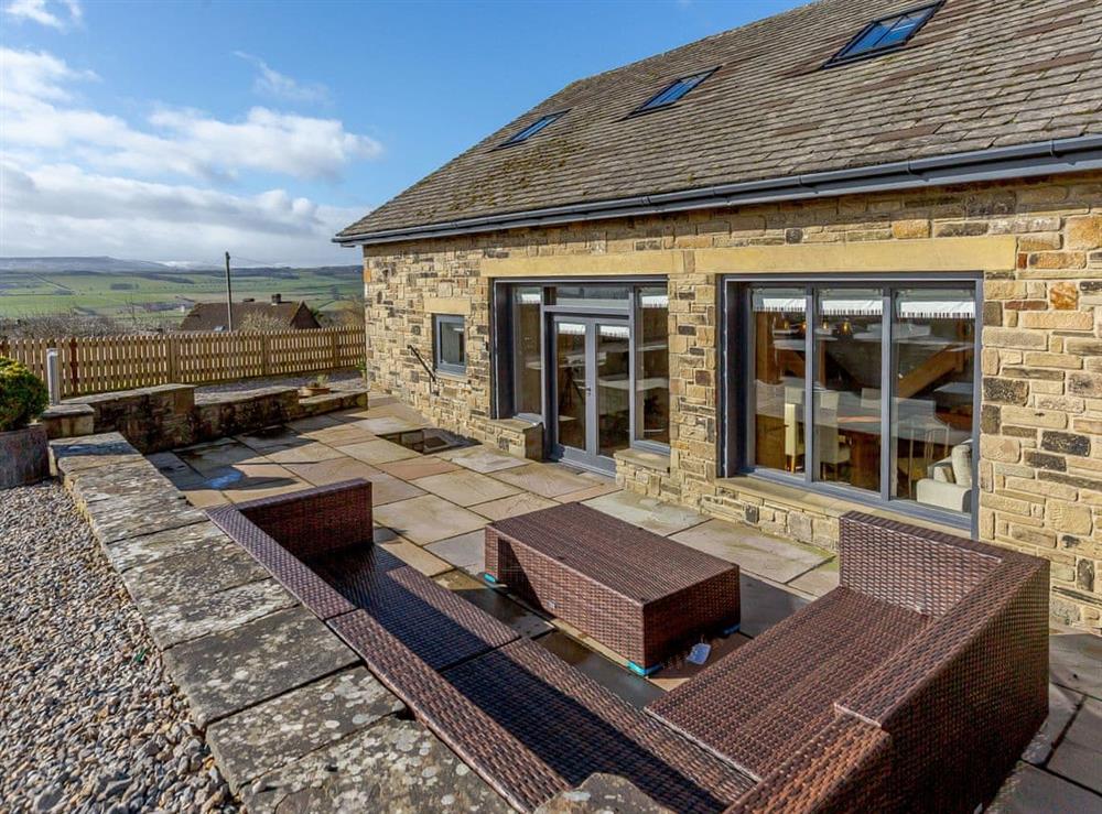 Sunken patio area with outdoor furniture at Penthwaite in Leyburn, North Yorkshire