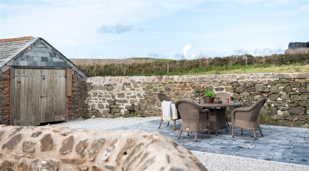 The outdoor seating area at Pentire Head Farmhouse in Polzeath, Cornwall