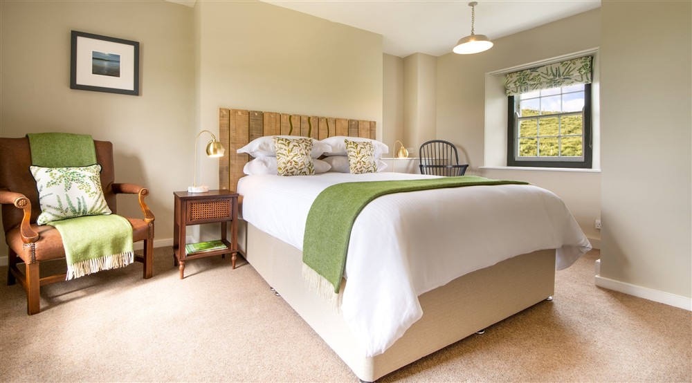 The bedroom with king sized bed at Pentireglaze East Cottage in Wadebridge, Cornwall
