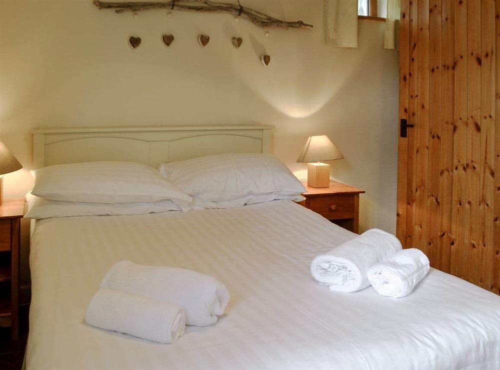 Warm and welcoming double bedroom at Siop Shoni Bric-a-moni, 