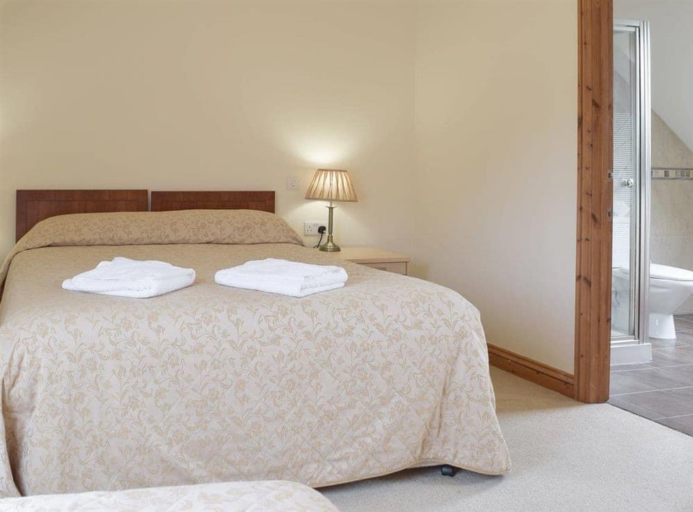 Double bedroom with an additional single bed (photo 2) at Pentre Cottage in Ferryside, Dyfed