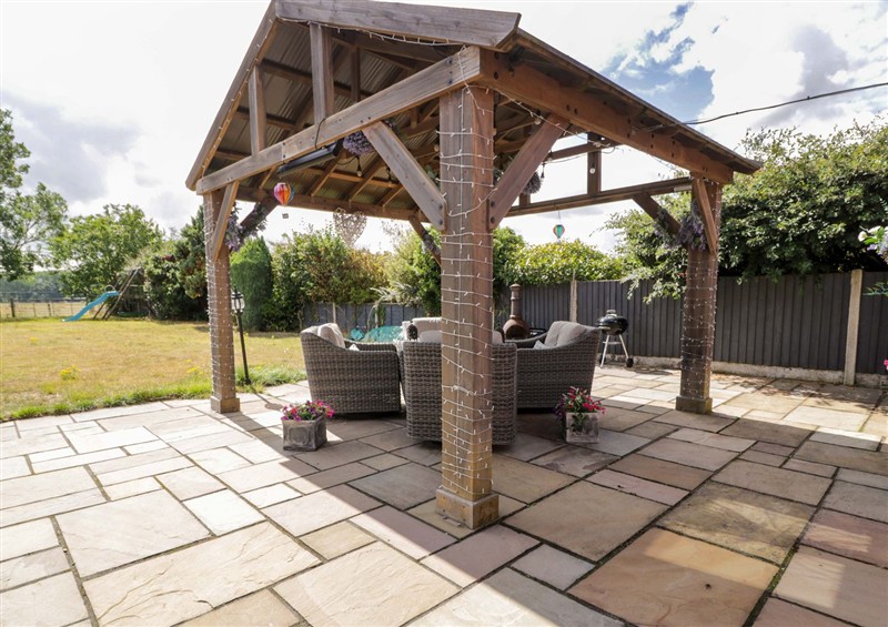 Enjoy a glass of wine on the patio at Pentre Country Studio, near Chirk