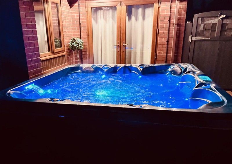Relax in the hot tub at Pentre Country Studio, near Chirk
