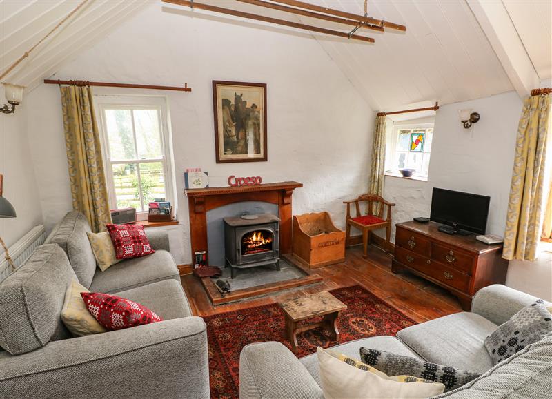 Relax in the living area at Penyrallt Fach Cottage, Pentre-Cwrt