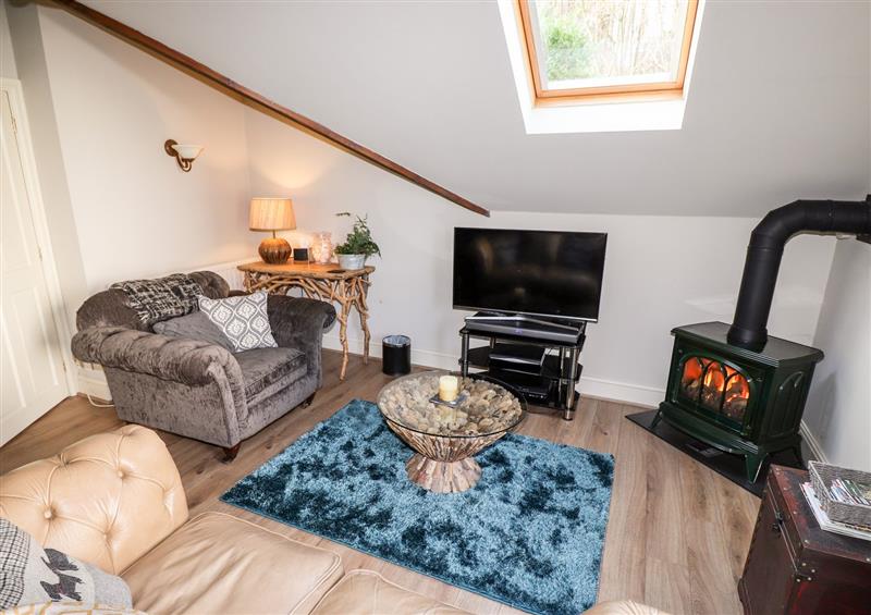 Relax in the living area at Peony Cottage, Lakeside near Newby Bridge