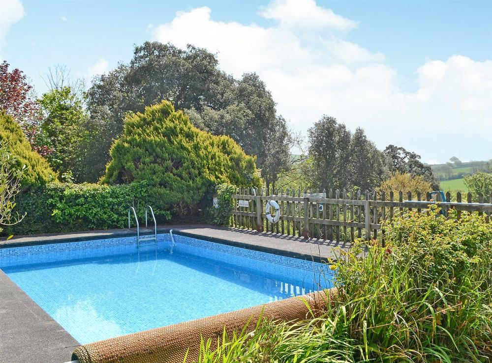 Wonderful outdoor heated swimming pool (shared with owner and other properties on-site) at Cloisters Cottage, 