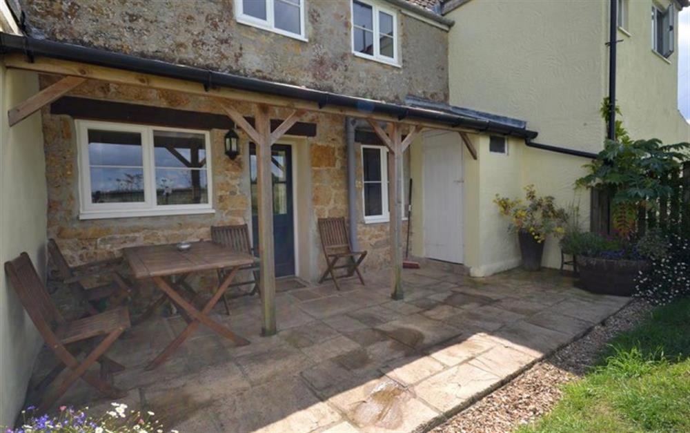 At the rear is a fully enclosed patio garden at Perhay Cottage in Bridport