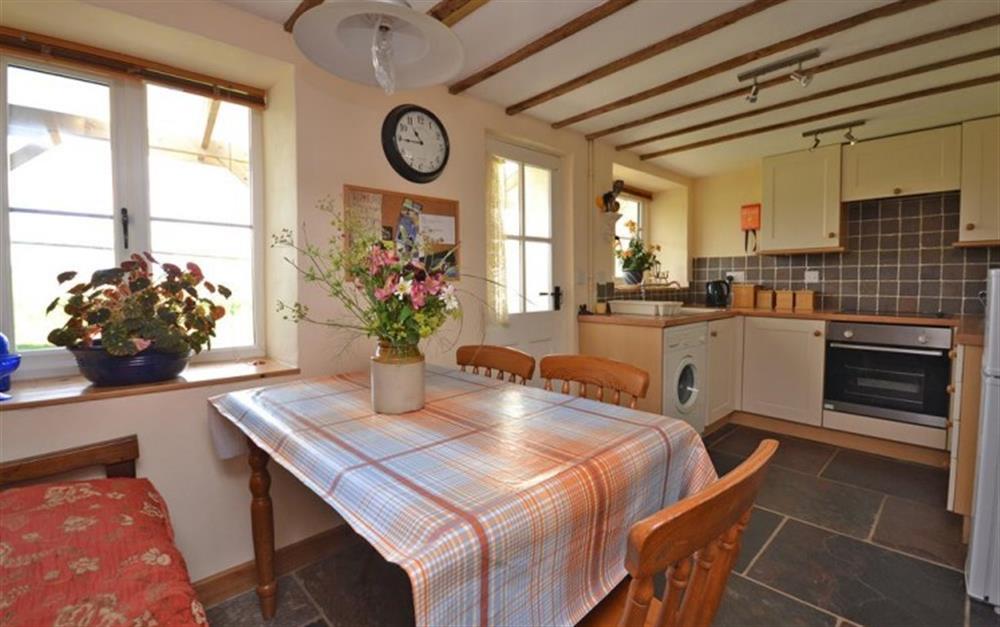 Dining area and kitchen at Perhay Cottage in Bridport