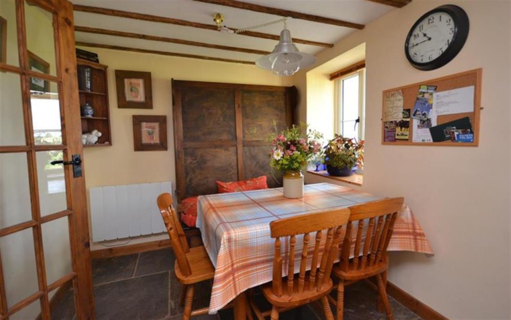 Dining table seats five at Perhay Cottage in Bridport