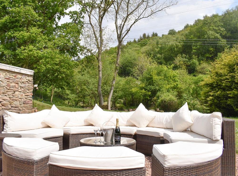 Luxurious outdoor seating area at Perivale Lodge in near Lydney, Gloucestershire