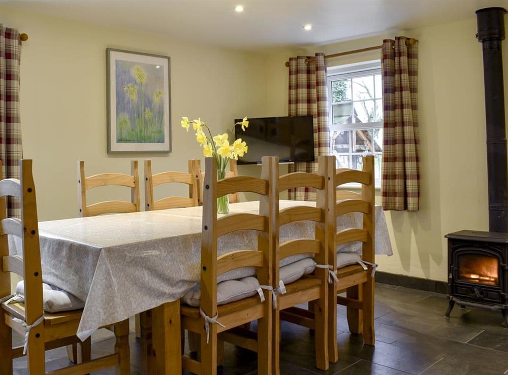 Delightful dining area with cosy wood burner at Pershbrook Cottage in Minsterworth, near Gloucester, Gloucestershire