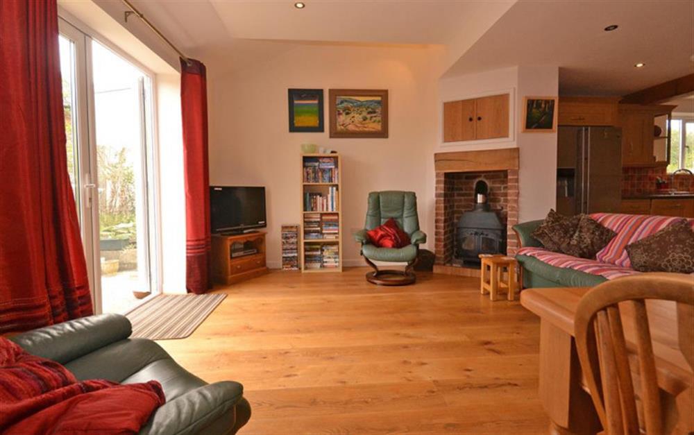 The living room with patio doors leading to the garden. at Petersfield in West Charleton