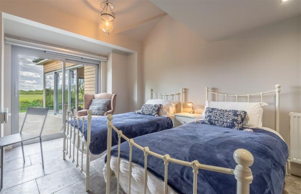 Ground floor: Bedroom two can be made up as a super-king or twin beds at Peterstone Lodge, Holkham near Wells-next-the-Sea