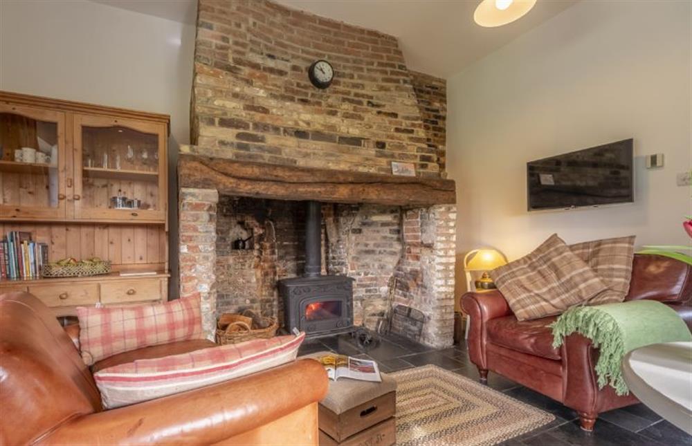 Sitting area with original feature fireplace at Pettingalls Farm Cottage, Deopham Green near Wymondham