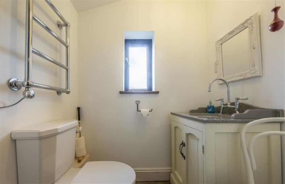 WC a wash basin, WC and heated towel rail. at Pettingalls Farm Cottage, Deopham Green near Wymondham