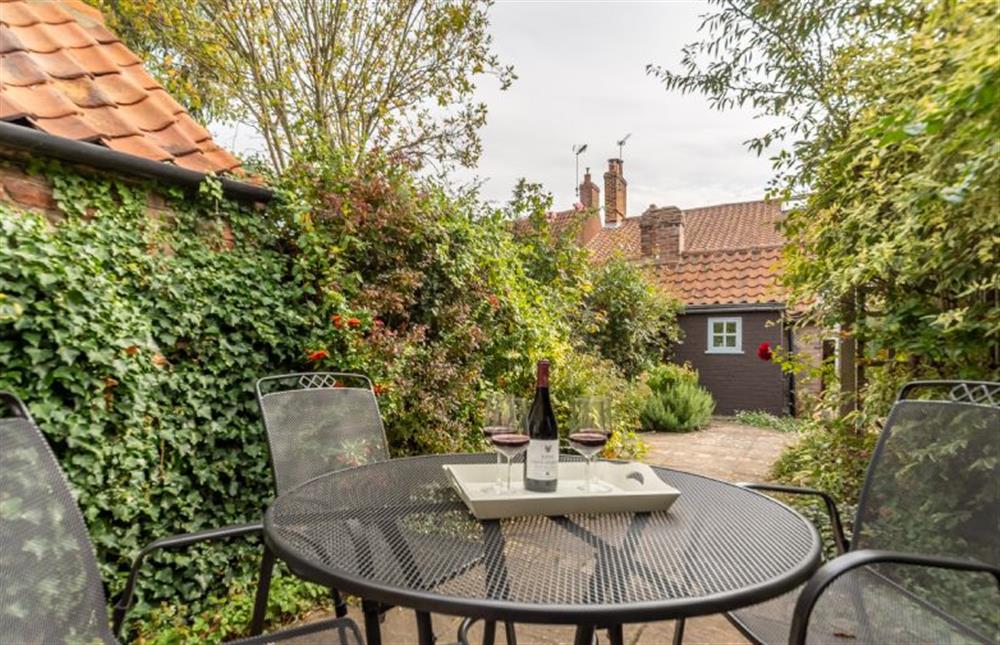 The courtyard garden is quiet and sheltered at Petts Cottage, Burnham Market near Kings Lynn