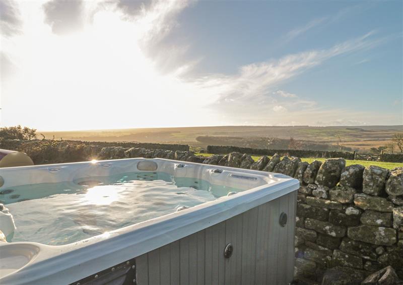 Hot tub with views at Petty Knowes Cottage, Rochester near Otterburn, Northumberland