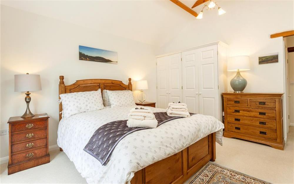 The master bedroom with king size bed at Pheasant Cottage in Salcombe