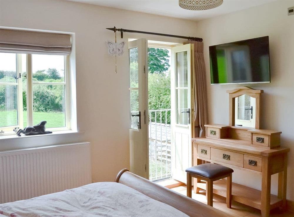 Double bedroom with juliet balcony at Pheasant Fields in Lloc, near Holywell, Clwyd