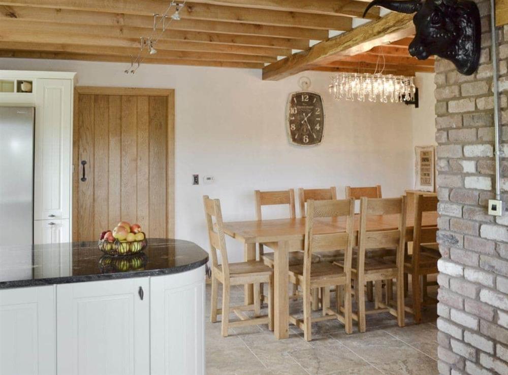 Kitchen/dining room with traditional features such as exposed brickwork at Pheasant Fields in Lloc, near Holywell, Clwyd