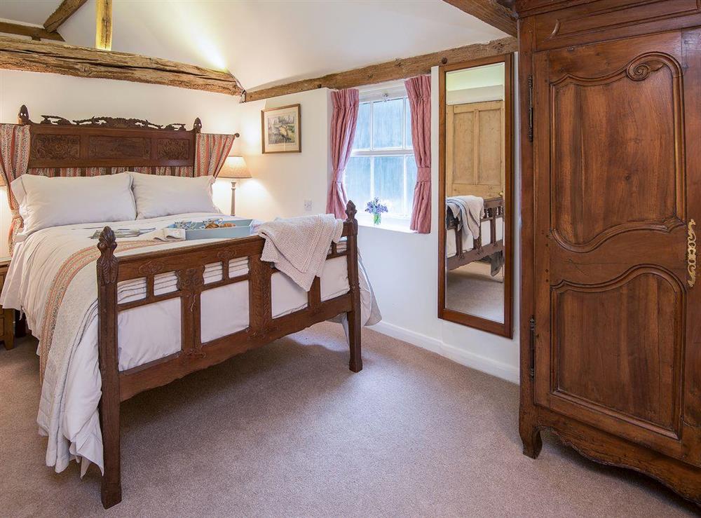Beautiful double bedroom with gorgeous furniture at Pheasants Hill Old Byre in Hambleden, near Henley-on-Thames, Buckinghamshire, England