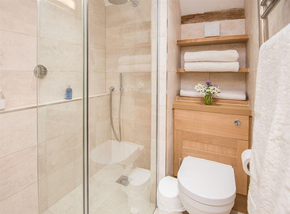 Practical en-suite with walk-in shower cubicle at Pheasants Hill Old Byre in Hambleden, near Henley-on-Thames, Buckinghamshire, England