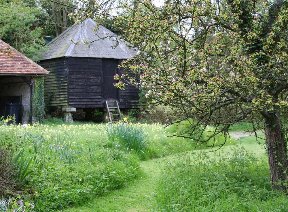 The former granary in the one acre garden and grounds at Pheasants Hill Old Byre in Hambleden, near Henley-on-Thames, Buckinghamshire, England