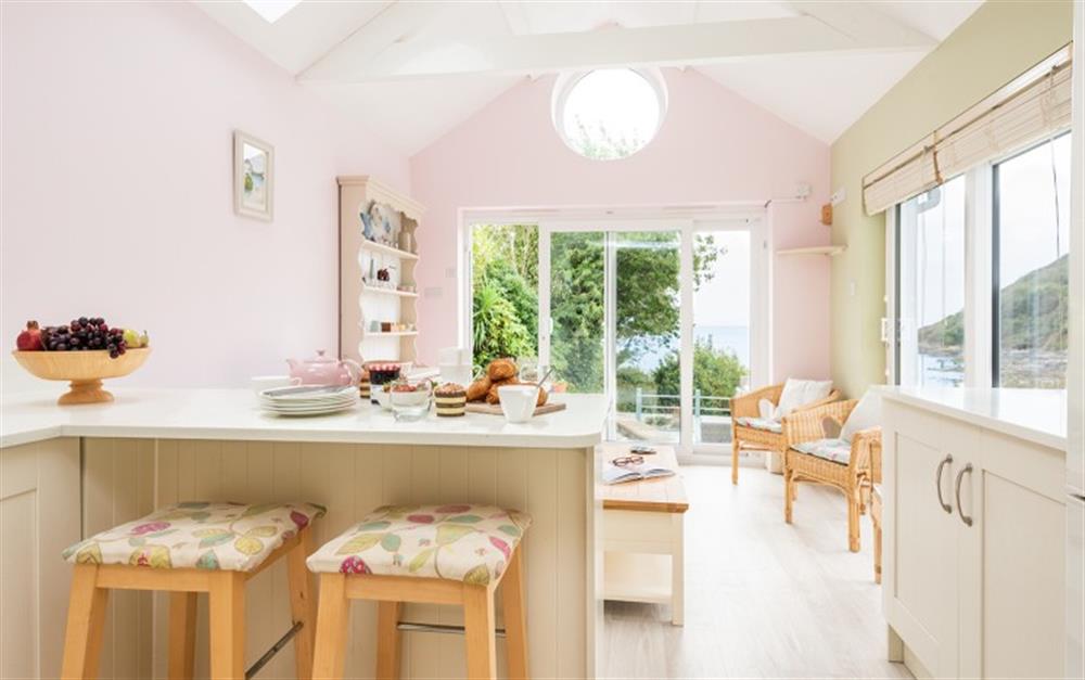 Kitchen/Snug with sea views at Phoenix and Little Phoenix in Talland Bay