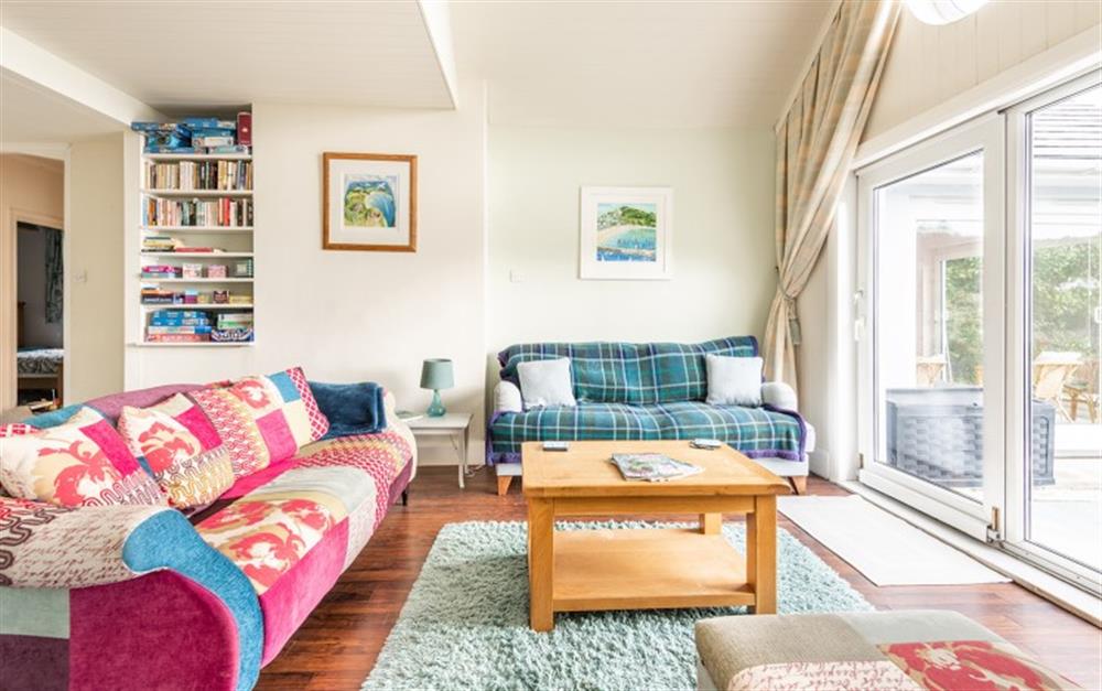 The large living space with open fire and views at Phoenix in Talland Bay