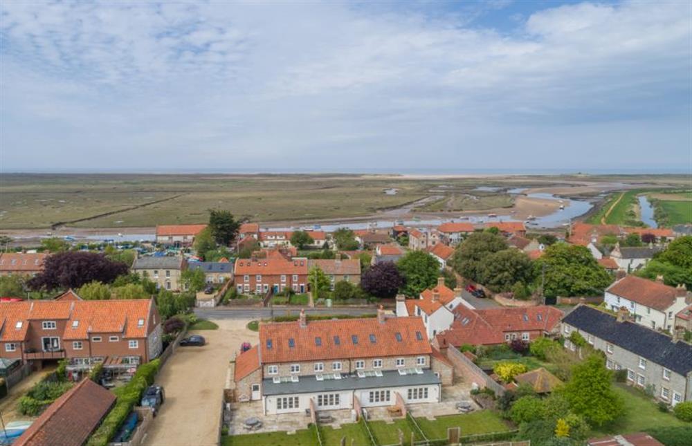 Aerial view of Burnham Overy Staithe and The Hero cottages in the foreground