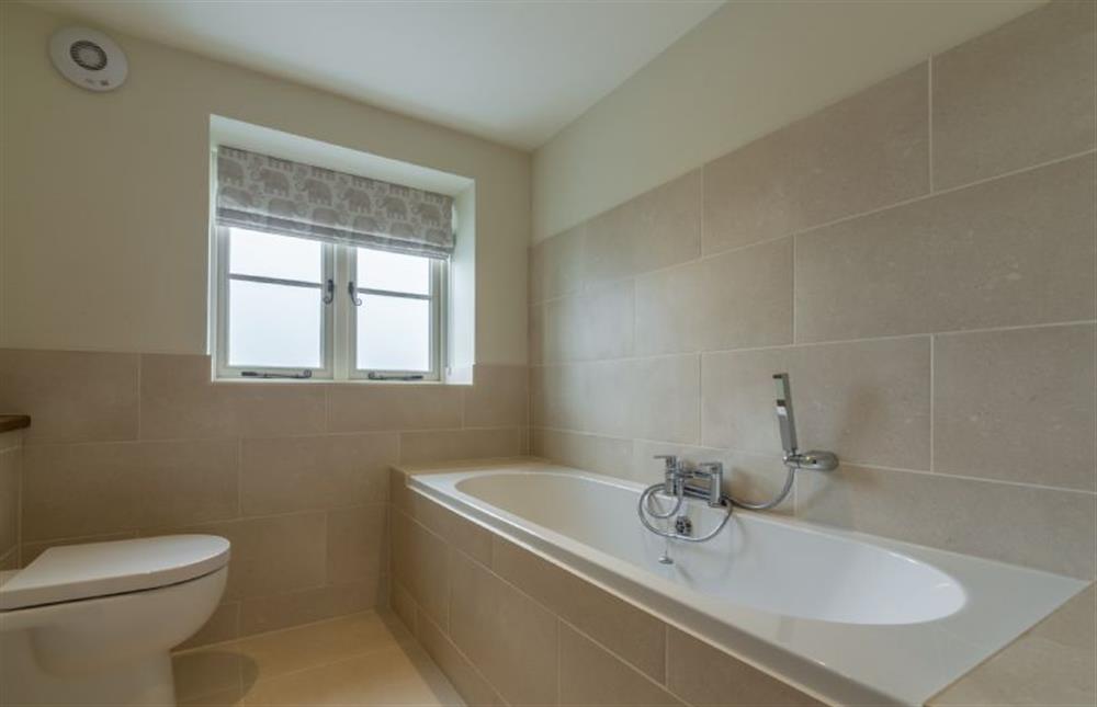 First floor: Bathroom with double ended bath and hand-held shower at Picarini, Burnham Overy Staithe near Kings Lynn