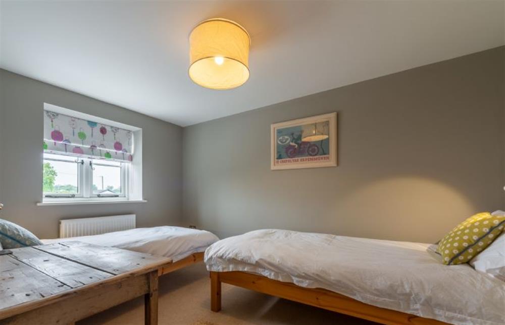 First floor: Bedroom three has twin single beds at Picarini, Burnham Overy Staithe near Kings Lynn