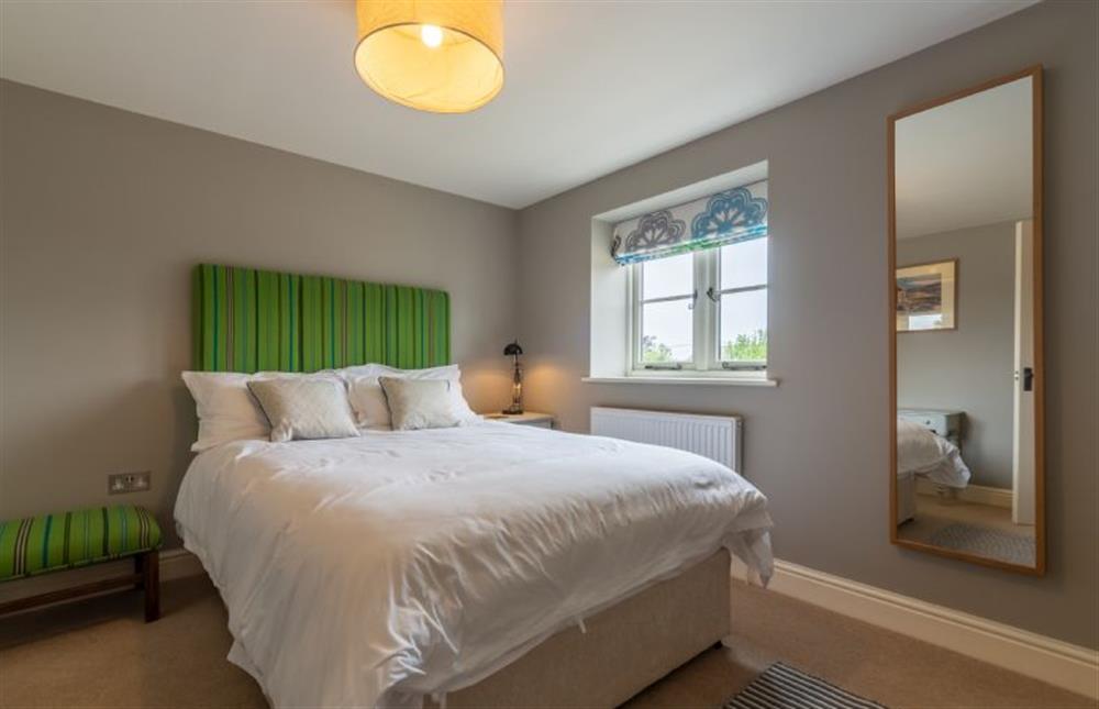 First floor: Bedroom two with double bed at Picarini, Burnham Overy Staithe near Kings Lynn