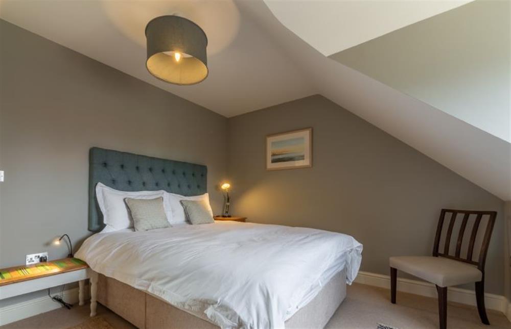 Second floor: King-size bed in the master bedroom at Picarini, Burnham Overy Staithe near Kings Lynn