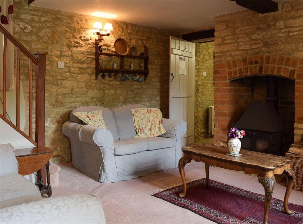 Cosy living room with wood burner (photo 2) at Picket Piece Cottage in Chadlington, near Chipping Norton, Oxfordshire