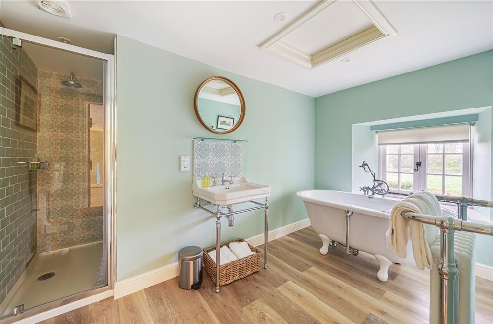 Relax in the roll-top bath, at Puddle Cottage at Piddle and Puddle, Dorchester
