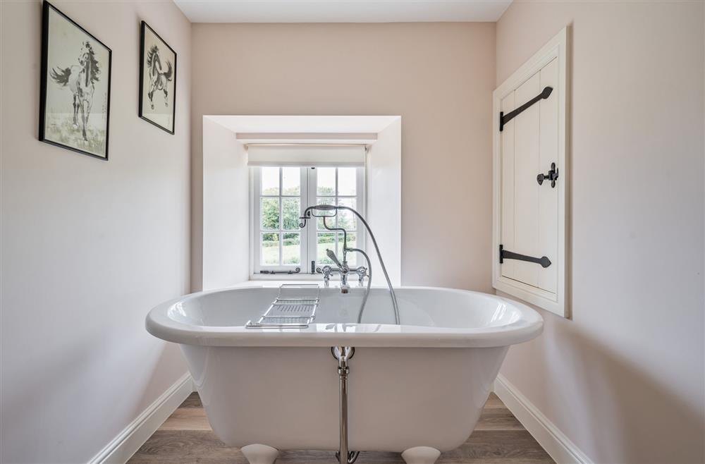 Enjoy the stunning views in the roll-top bath at Piddle Cottage, Dorchester