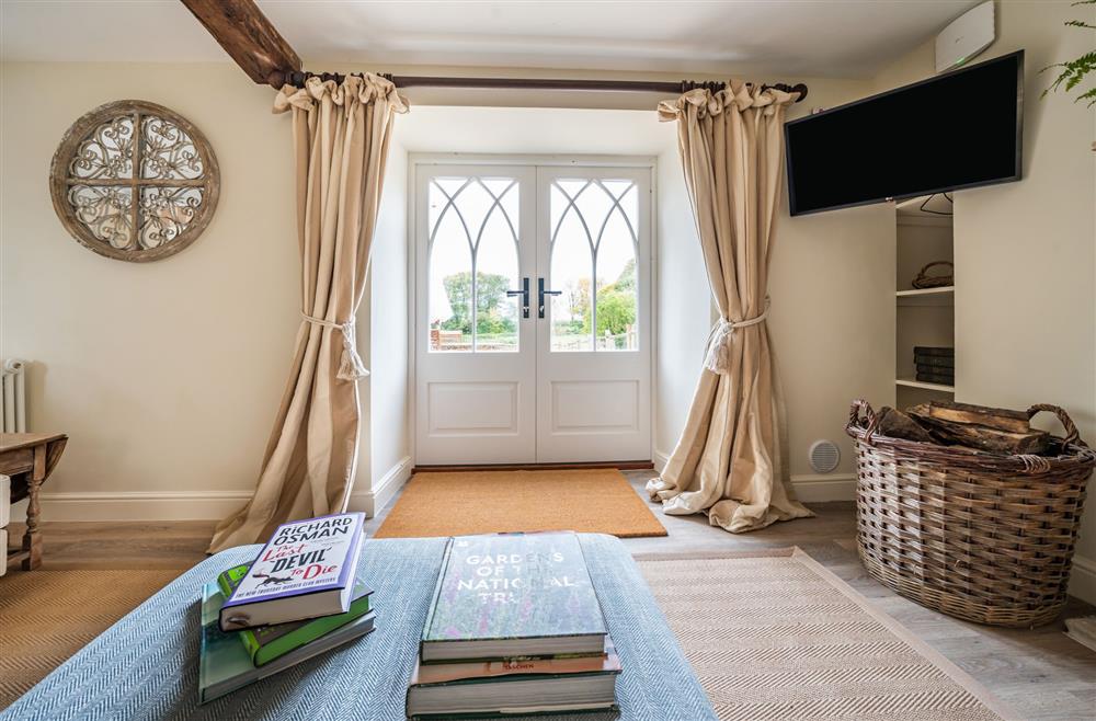 Enjoy views of the garden from the sitting area at Piddle Cottage, Dorchester