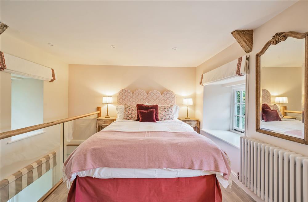 The bedroom with a king-size bed (photo 2) at Piddle Cottage, Dorchester