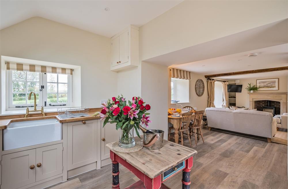 The open-plan kitchen, dining and sitting area at Piddle Cottage, Dorchester