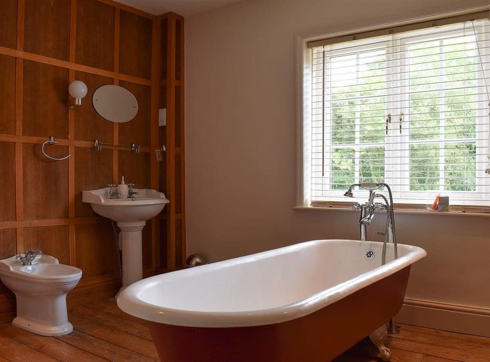 Wonderful bathroom with free-standing roll top bath at Pigeon Coo Farmhouse in Hamstead, near Yarmouth, Isle of Wight