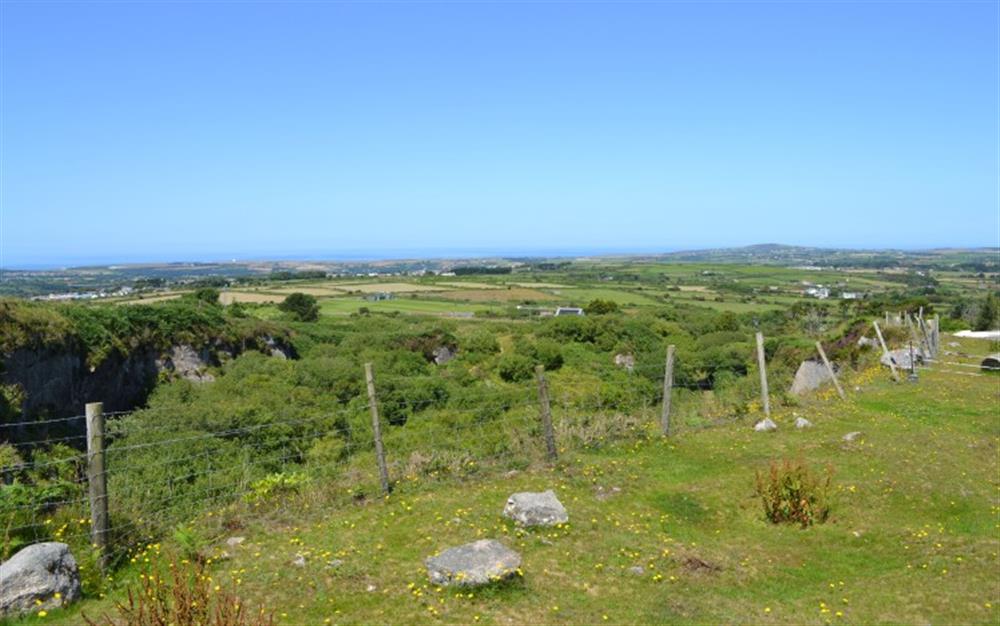 From the summit, you can see all the way across to the north coast! St Agnes Beacon is to the right, and the Atlantic sea to the left! at PigLet in Gwennap