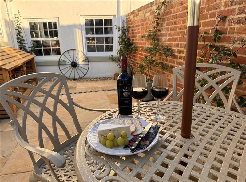 Enjoy a glass of wine on the patio at Pilchard Cottage, Dawlish