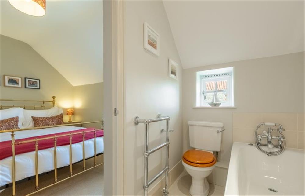 First floor: Bedroom two with en-suite bathroom at Pine Cottage, Thornham near Hunstanton