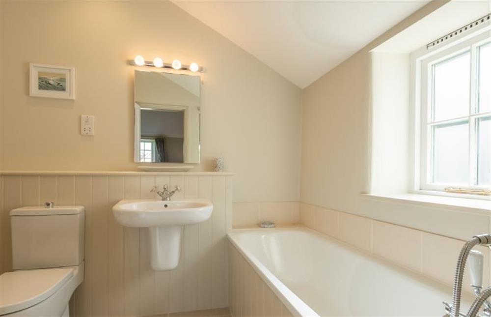 First floor: En-suite  bathroom at Pine Cottage, Thornham near Hunstanton
