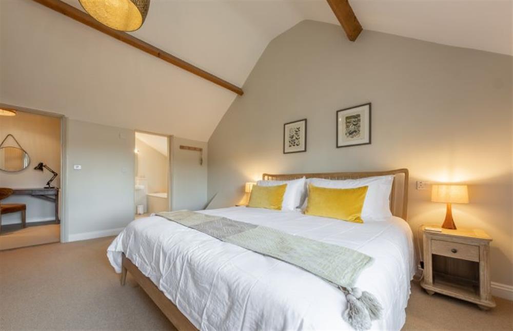 First floor: Master bedroom with en-suite at Pine Cottage, Thornham near Hunstanton