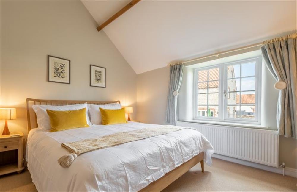 First floor: Master bedroom at Pine Cottage, Thornham near Hunstanton
