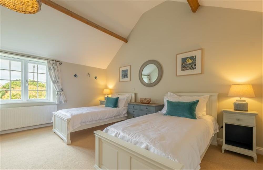 First floor: Twin bedroom with en-suite at Pine Cottage, Thornham near Hunstanton