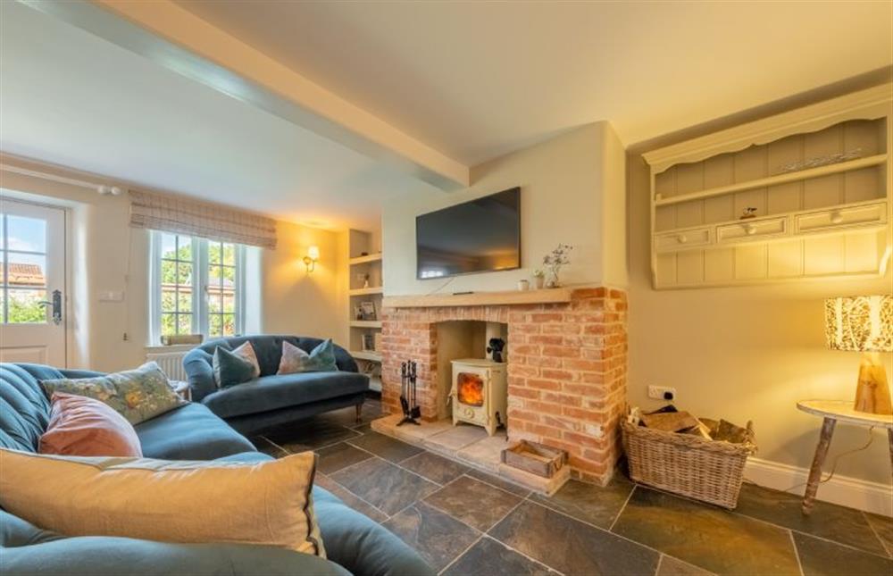 Ground floor: Seating area with doors to enclosed garden at Pine Cottage, Thornham near Hunstanton