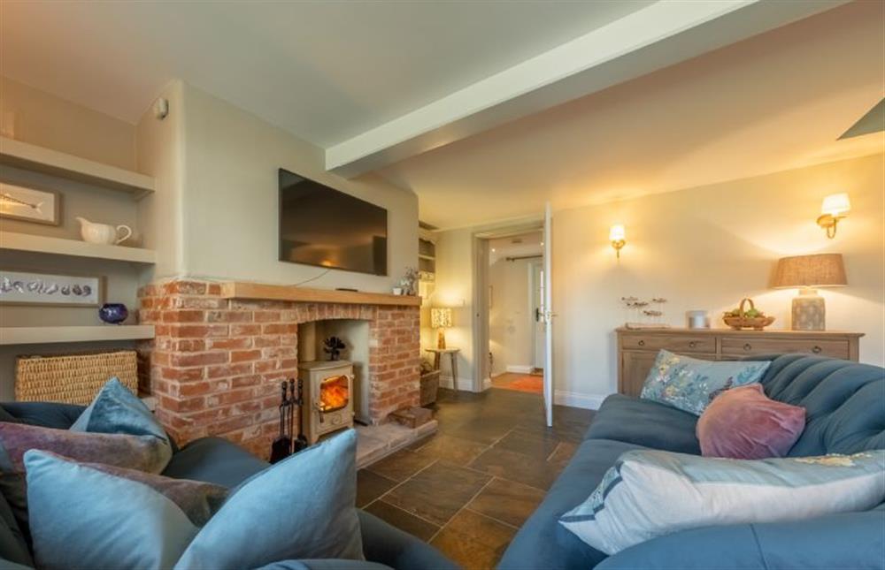 Ground floor: Spacious seating area with wood burning stove at Pine Cottage, Thornham near Hunstanton